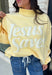 Wrap yourself in faith and comfort with this butter yellow pullover that shares a message worth wearing! Featuring cheerful bubble lettering that reads "Jesus Saves," this cozy soft sweatshirt is the perfect reminder of hope and grace wherever your day takes you. The fleece-lined interior keeps you warm and cozy, while the exposed seam details and ribbed trim give it a laid-back, lived-in feel. 