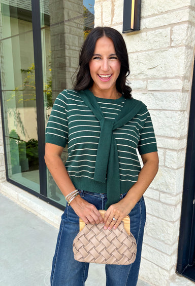 Get the layered look without the extra effort in this cozy short sleeve sweater. Featuring rich hunter green and off white stripes, this knit is designed with an attached layered scarf detail that instantly elevates your outfit. The soft sweater knit keeps you cozy while the short sleeves make it perfect for transitioning through the season and layering under your favorite jackets. 