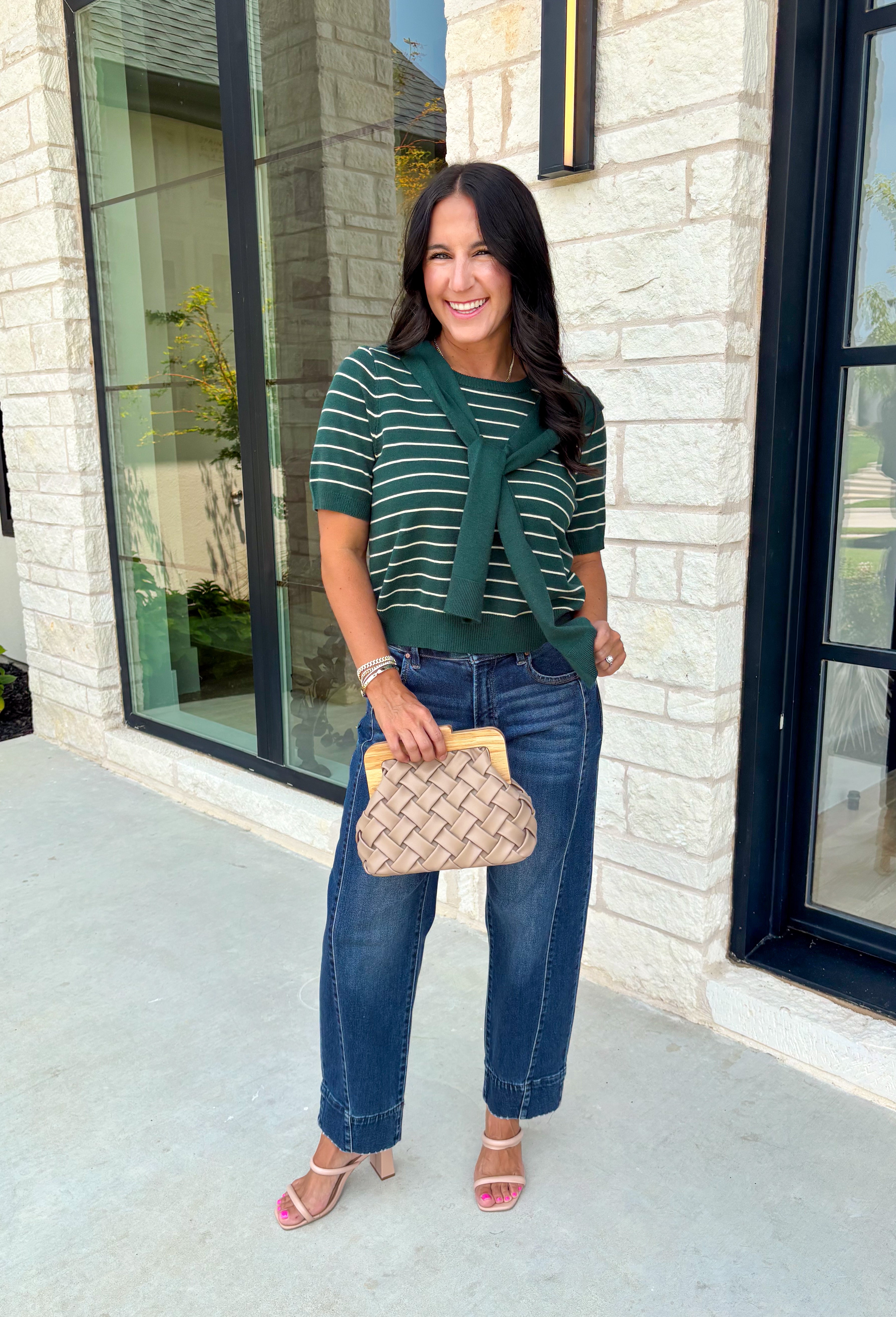 Get the layered look without the extra effort in this cozy short sleeve sweater. Featuring rich hunter green and off white stripes, this knit is designed with an attached layered scarf detail that instantly elevates your outfit. The soft sweater knit keeps you cozy while the short sleeves make it perfect for transitioning through the season and layering under your favorite jackets. 