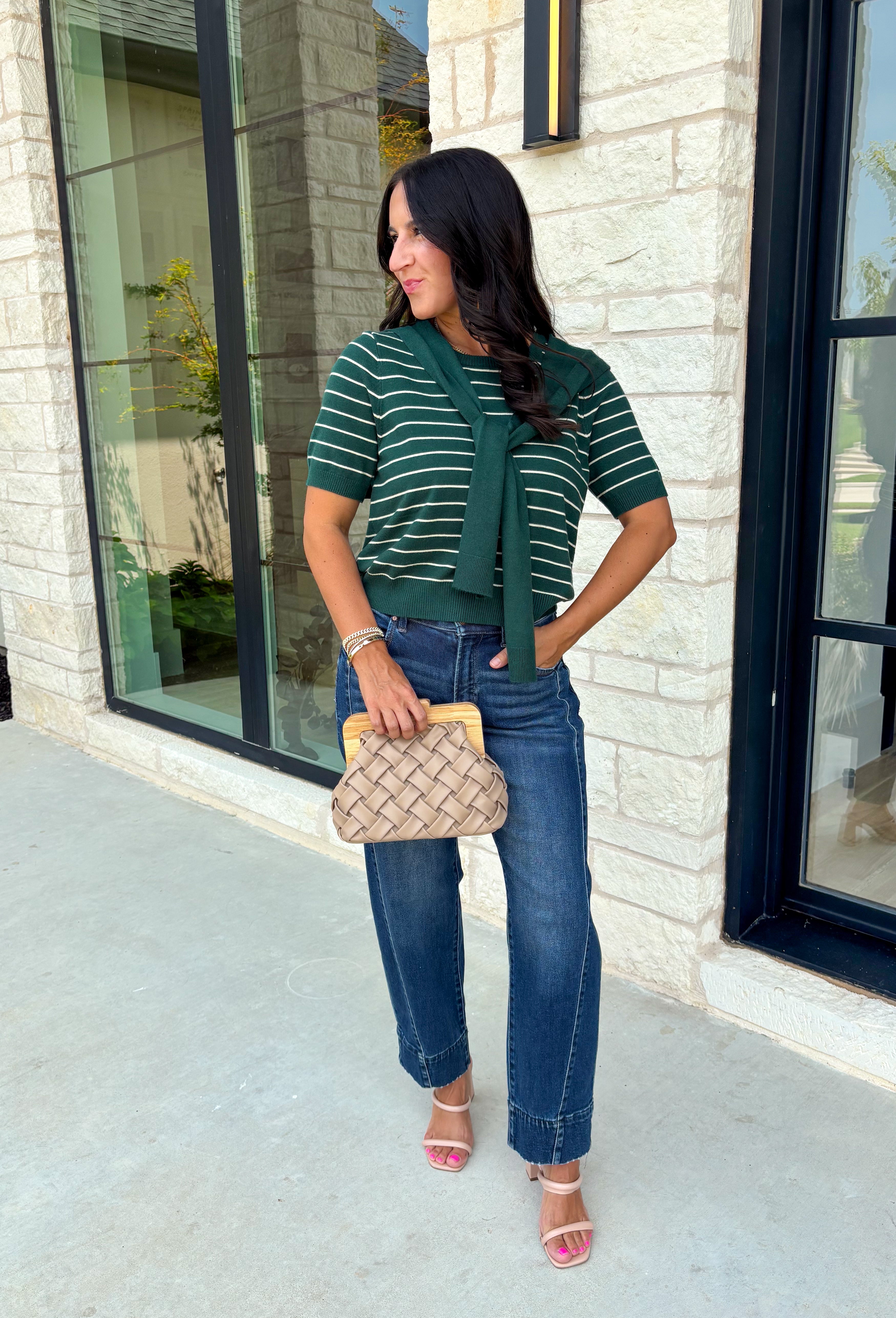 Get the layered look without the extra effort in this cozy short sleeve sweater. Featuring rich hunter green and off white stripes, this knit is designed with an attached layered scarf detail that instantly elevates your outfit. The soft sweater knit keeps you cozy while the short sleeves make it perfect for transitioning through the season and layering under your favorite jackets. 