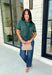 Get the layered look without the extra effort in this cozy short sleeve sweater. Featuring rich hunter green and off white stripes, this knit is designed with an attached layered scarf detail that instantly elevates your outfit. The soft sweater knit keeps you cozy while the short sleeves make it perfect for transitioning through the season and layering under your favorite jackets. 