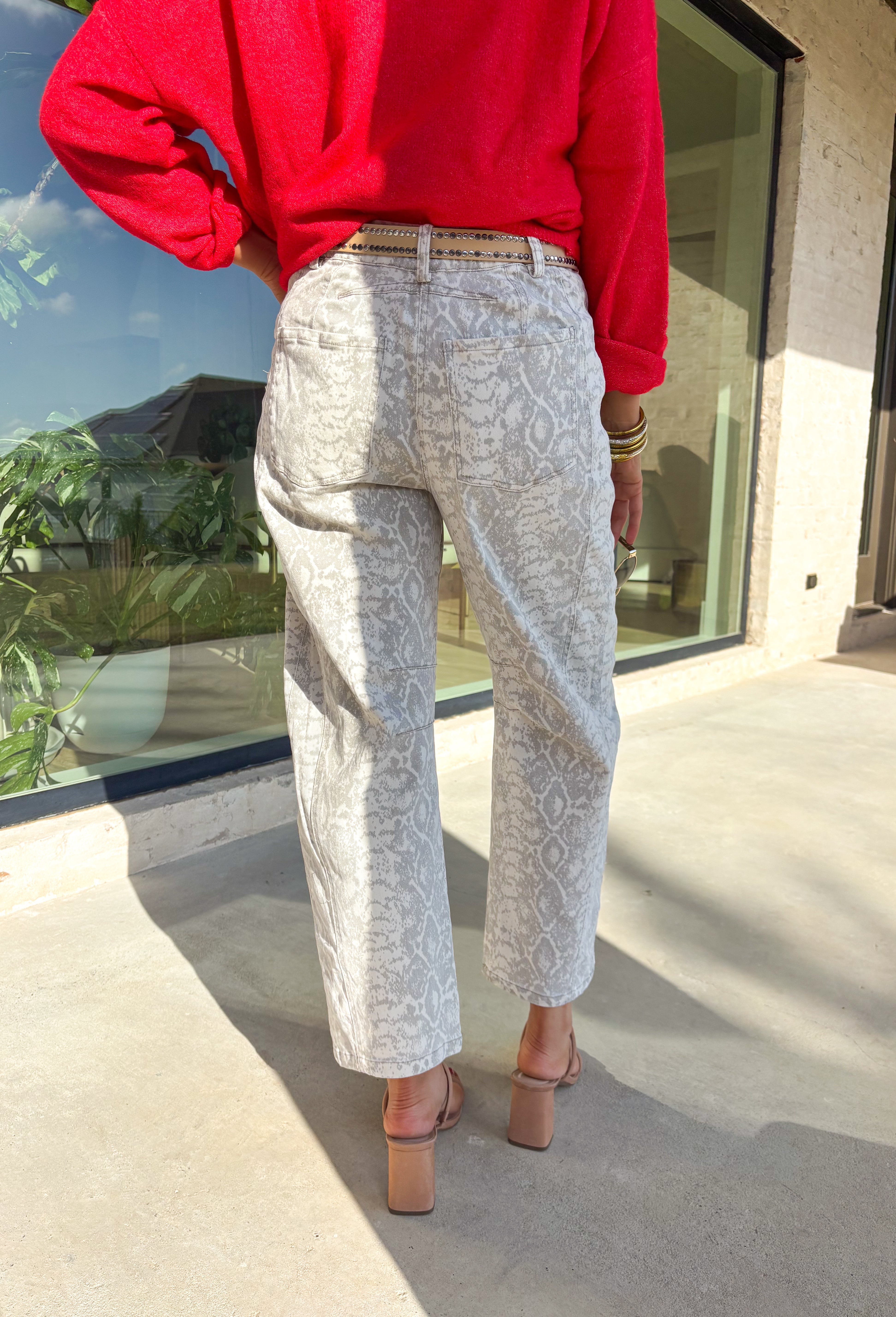 Step into the season with a hint of edge in these neutral snakeskin barrel jeans by Skies Are Blue. Designed with a flattering high-rise fit and a soft cotton blend, these jeans bring a chic twist to your winter wardrobe. The subtle snakeskin print adds texture and personality, while the barrel leg silhouette gives them a trendy, modern feel.