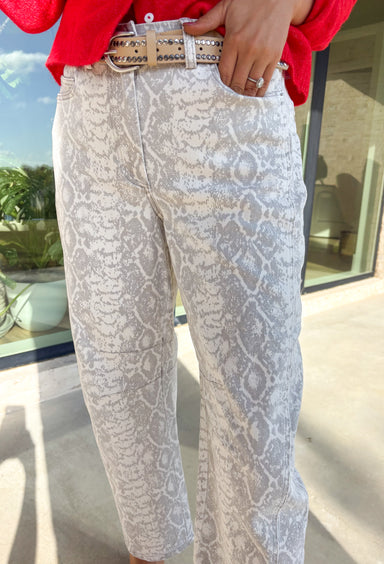 Step into the season with a hint of edge in these neutral snakeskin barrel jeans by Skies Are Blue. Designed with a flattering high-rise fit and a soft cotton blend, these jeans bring a chic twist to your winter wardrobe. The subtle snakeskin print adds texture and personality, while the barrel leg silhouette gives them a trendy, modern feel.