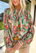 Make a statement this fall with a top that’s as bold as your favorite autumn latte. This neutral long sleeve blouse features a stunning mix of bold leaves and abstract floral patterns in rich seasonal shades of green, brown, orange, red, and tan. The balloon sleeves with elastic cuffs add a touch of drama while keeping things comfy and casual. It’s the perfect top for everything from the office to dinner with the girls.