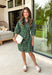 Fresh color meets effortless style in this beautifully designed dress from Entro. Featuring a soft light blue backdrop with a striking hunter green abstract print, this timeless dress is perfect for transitioning through the season. The collared neckline and button-front design create a polished, classic look, while the matching self-tie belt cinches the waist for a flattering silhouette. 