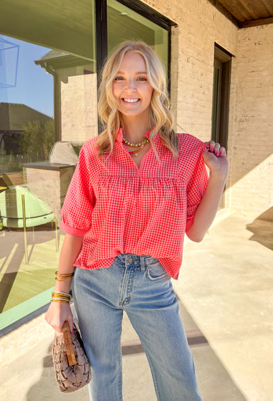 Sweet, playful, and perfect for Valentine’s Day, this red and pink mini gingham top by Wishlist is full of charm. The classic gingham print gives it that flirty, vintage-inspired feel, while the subtle ruffle neckline adds a soft, feminine touch. Lightweight and easy to style, it’s the kind of top you can wear for February plans and keep in rotation all spring long.