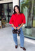 Add a timeless staple to your wardrobe with this cozy cardigan from Double Zero. Designed in a rich red hue, this short sleeve knit is the perfect combination of classic style and everyday comfort. The button-front design makes it easy to wear on its own as a sweater or layered over your favorite basics, while the ribbed neckline adds a polished finishing touch. Soft, versatile, and easy to style, this cardigan is one you'll find yourself reaching for all season long.