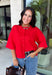 Add a timeless staple to your wardrobe with this cozy cardigan from Double Zero. Designed in a rich red hue, this short sleeve knit is the perfect combination of classic style and everyday comfort. The button-front design makes it easy to wear on its own as a sweater or layered over your favorite basics, while the ribbed neckline adds a polished finishing touch. Soft, versatile, and easy to style, this cardigan is one you'll find yourself reaching for all season long.