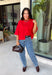 Add a timeless staple to your wardrobe with this cozy cardigan from Double Zero. Designed in a rich red hue, this short sleeve knit is the perfect combination of classic style and everyday comfort. The button-front design makes it easy to wear on its own as a sweater or layered over your favorite basics, while the ribbed neckline adds a polished finishing touch. Soft, versatile, and easy to style, this cardigan is one you'll find yourself reaching for all season long.