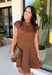 Holiday plans call for a dress that feels just as special as the occasion, and this brown faux suede dress from Fate is ready for every invite. The rich brown color and soft faux suede give it a warm seasonal look, while the structured paneled silhouette creates a flattering, defined shape. Vertical seaming through the bodice draws the eye to the fitted waist and hips before flowing into a flared A-line skirt. 
