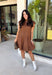 Holiday plans call for a dress that feels just as special as the occasion, and this brown faux suede dress from Fate is ready for every invite. The rich brown color and soft faux suede give it a warm seasonal look, while the structured paneled silhouette creates a flattering, defined shape. Vertical seaming through the bodice draws the eye to the fitted waist and hips before flowing into a flared A-line skirt. 