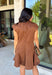 Holiday plans call for a dress that feels just as special as the occasion, and this brown faux suede dress from Fate is ready for every invite. The rich brown color and soft faux suede give it a warm seasonal look, while the structured paneled silhouette creates a flattering, defined shape. Vertical seaming through the bodice draws the eye to the fitted waist and hips before flowing into a flared A-line skirt. 