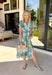 Bold, bright, and full of personality — this blue midi dress is made to stand out. The colorful floral print features shades of yellow, green, blue, and white, giving it that fresh, sunshine-ready feel. What makes it extra special? The contrasting abstract print in orange, pink, and blue along the front, sleeves, and hem for a playful pop of color that truly sets it apart. 