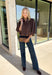 Meet the kind of top that makes getting dressed for the day feel easy. This solid top from Entro features a stand collar and partial button-front closure for a clean, classic look that works just as well at the office as it does for weekend plans. The ¾ balloon sleeves bring a little volume to the silhouette, while the elastic hem creates a flattering shape without needing to tuck it in. Lightweight and versatile, it’s an easy piece to pair with denim, trousers, or skirts throughout the fall season.