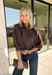 Meet the kind of top that makes getting dressed for the day feel easy. This solid top from Entro features a stand collar and partial button-front closure for a clean, classic look that works just as well at the office as it does for weekend plans. The ¾ balloon sleeves bring a little volume to the silhouette, while the elastic hem creates a flattering shape without needing to tuck it in. Lightweight and versatile, it’s an easy piece to pair with denim, trousers, or skirts throughout the fall season.