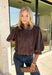Meet the kind of top that makes getting dressed for the day feel easy. This solid top from Entro features a stand collar and partial button-front closure for a clean, classic look that works just as well at the office as it does for weekend plans. The ¾ balloon sleeves bring a little volume to the silhouette, while the elastic hem creates a flattering shape without needing to tuck it in. Lightweight and versatile, it’s an easy piece to pair with denim, trousers, or skirts throughout the fall season.