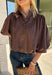 Meet the kind of top that makes getting dressed for the day feel easy. This solid top from Entro features a stand collar and partial button-front closure for a clean, classic look that works just as well at the office as it does for weekend plans. The ¾ balloon sleeves bring a little volume to the silhouette, while the elastic hem creates a flattering shape without needing to tuck it in. Lightweight and versatile, it’s an easy piece to pair with denim, trousers, or skirts throughout the fall season.