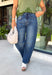 Everyone’s favorite jean is back in a versatile new wash you'll wear on repeat! These dark wash barrel jeans combine the trending silhouette everyone loves with a rich, polished color that transitions effortlessly through every season. The flattering high-rise fit creates a streamlined look, while the barrel leg shape adds a modern touch that's both comfortable and easy to style. 