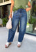 Everyone’s favorite jean is back in a versatile new wash you'll wear on repeat! These dark wash barrel jeans combine the trending silhouette everyone loves with a rich, polished color that transitions effortlessly through every season. The flattering high-rise fit creates a streamlined look, while the barrel leg shape adds a modern touch that's both comfortable and easy to style. 