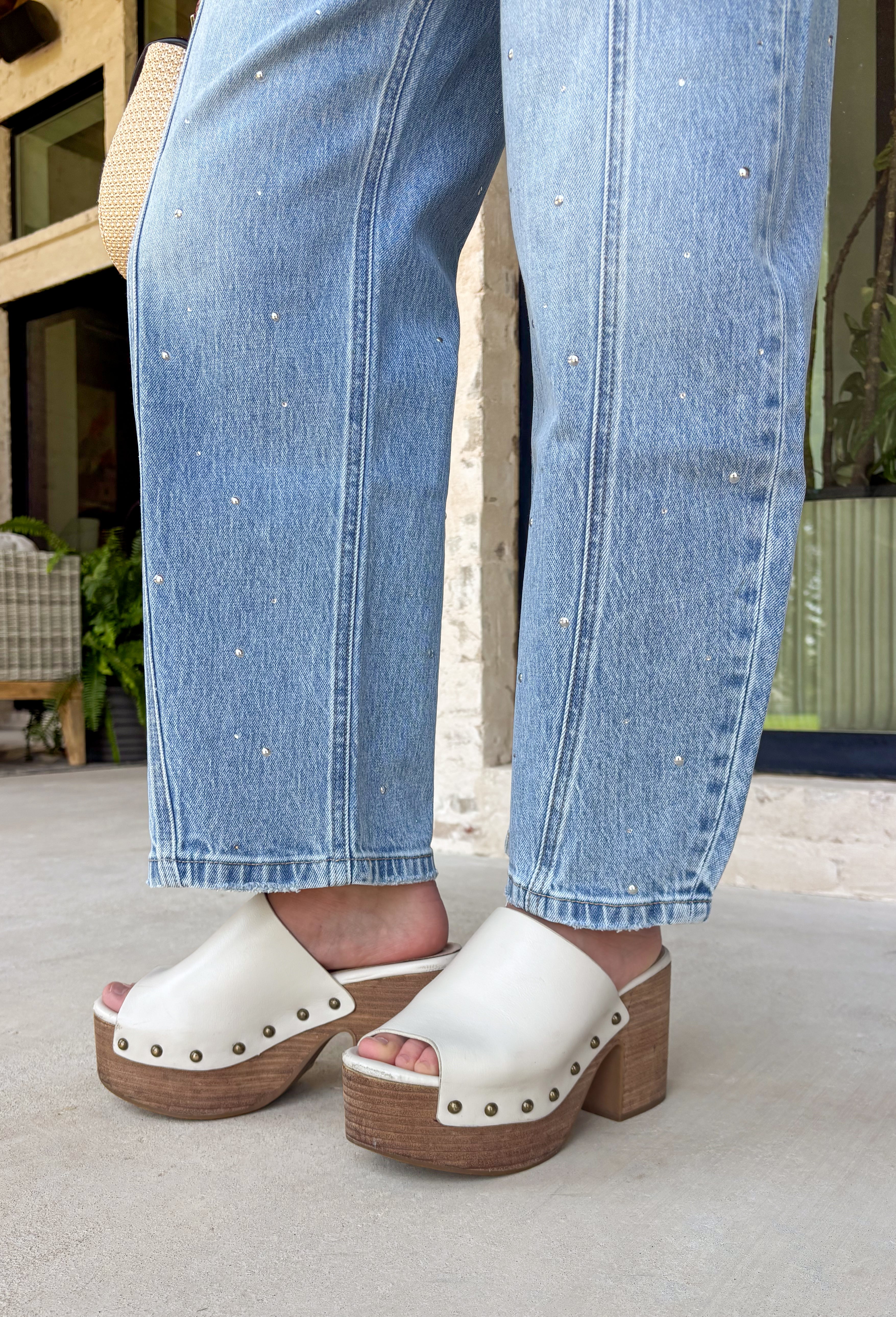 Everyone's favorite barrel jean just got a glamorous upgrade! These high-rise light wash barrel jeans feature crystal and embellishment details throughout, giving a trendy silhouette an eye-catching twist. The flattering high-rise fit helps create a streamlined shape, while the relaxed barrel leg keeps them comfortable and on-trend. Perfect for date nights, concerts, weekend outings, or simply elevating your everyday style, these jeans effortlessly blend casual and chic.