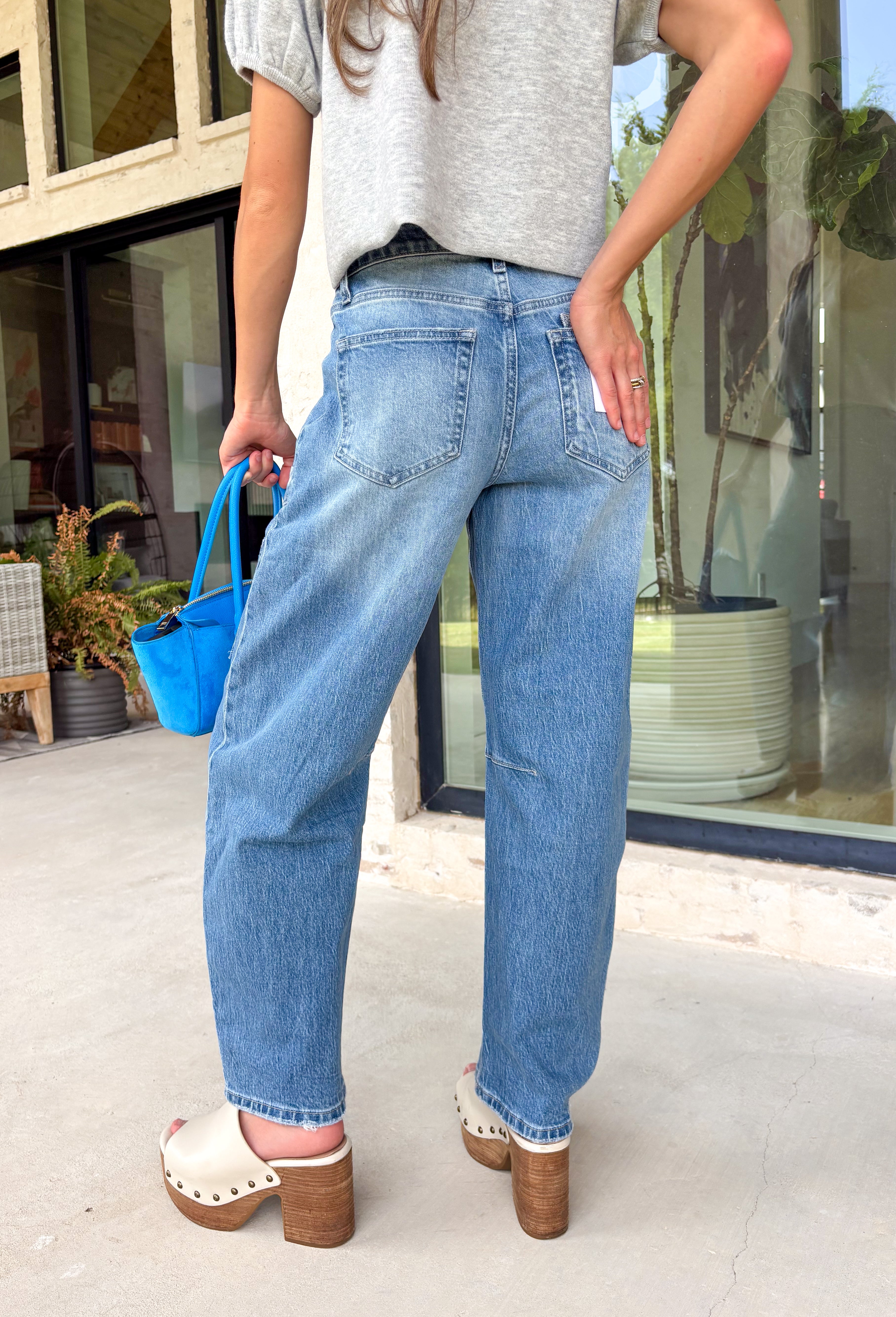 Your favorite barrel jeans are back in a fresh new style! These medium wash barrel jeans from Vervet feature the same flattering silhouette you already love, now updated with eye-catching patchwork detailing for an effortlessly cool, lived-in look. Crafted from comfortable stretch denim, they offer an easy fit that's perfect for everyday wear while adding a unique touch to any outfit. 