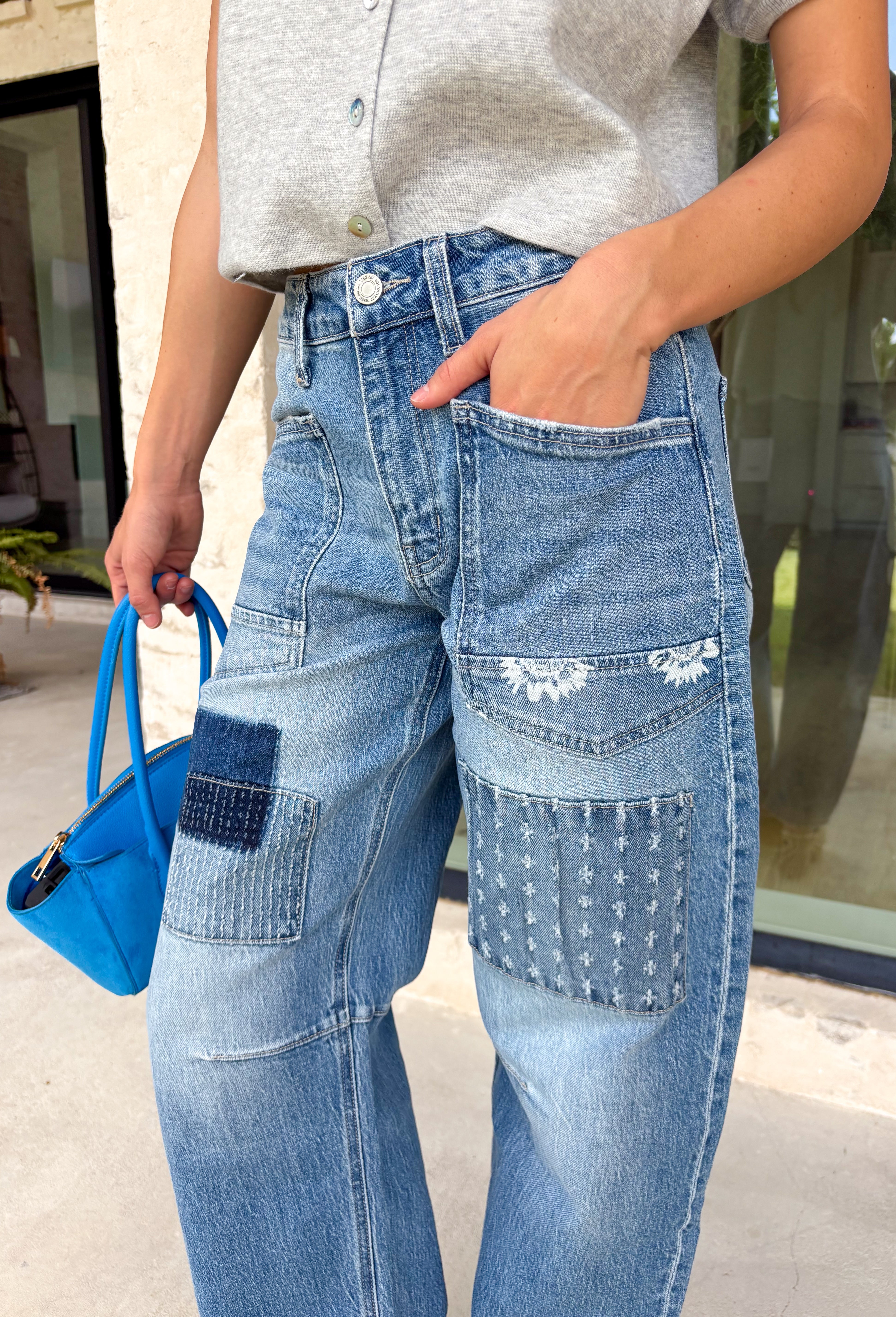 Your favorite barrel jeans are back in a fresh new style! These medium wash barrel jeans from Vervet feature the same flattering silhouette you already love, now updated with eye-catching patchwork detailing for an effortlessly cool, lived-in look. Crafted from comfortable stretch denim, they offer an easy fit that's perfect for everyday wear while adding a unique touch to any outfit. 