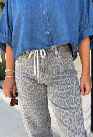 Everyone’s favorite barrel jean is back in a fun new print! These high waisted gray leopard print jeans are the perfect way to add a little personality to your everyday wardrobe while still keeping things neutral and easy to style. The barrel leg silhouette gives them that trendy, relaxed look everyone loves, while the drawstring detail adds an extra touch of comfort and casual charm. The gray-toned leopard print feels fresh and versatile, making these jeans easy to pair with everything.