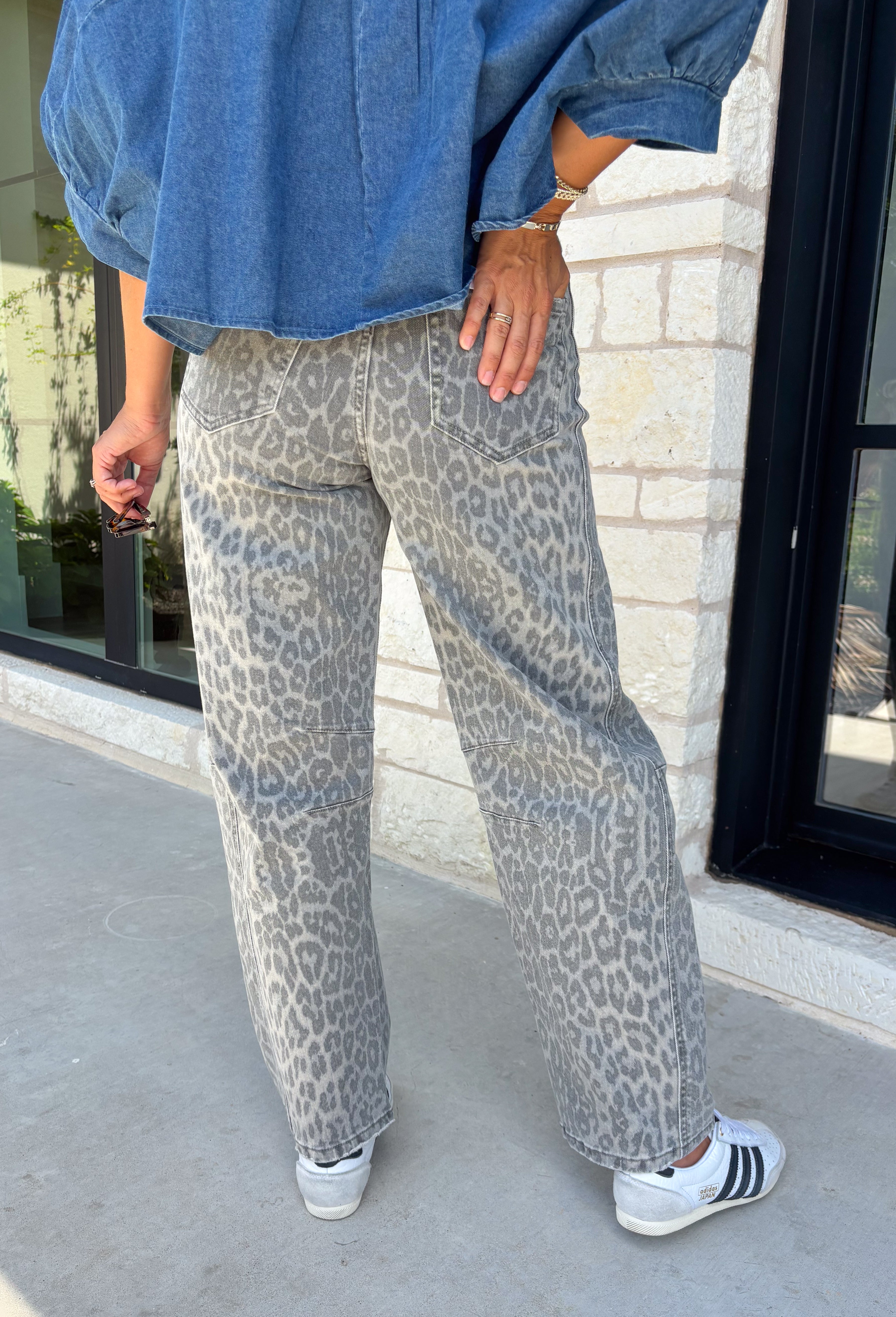 Everyone’s favorite barrel jean is back in a fun new print! These high waisted gray leopard print jeans are the perfect way to add a little personality to your everyday wardrobe while still keeping things neutral and easy to style. The barrel leg silhouette gives them that trendy, relaxed look everyone loves, while the drawstring detail adds an extra touch of comfort and casual charm. The gray-toned leopard print feels fresh and versatile, making these jeans easy to pair with everything.