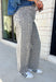 Everyone’s favorite barrel jean is back in a fun new print! These high waisted gray leopard print jeans are the perfect way to add a little personality to your everyday wardrobe while still keeping things neutral and easy to style. The barrel leg silhouette gives them that trendy, relaxed look everyone loves, while the drawstring detail adds an extra touch of comfort and casual charm. The gray-toned leopard print feels fresh and versatile, making these jeans easy to pair with everything.
