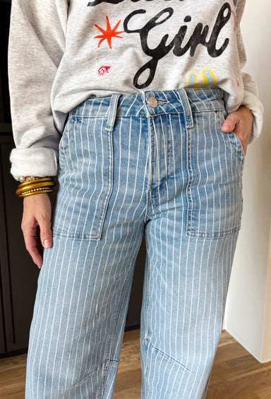 Your favorite Vervet barrel jean just got a fresh new update. This medium wash high rise denim features a white pinstripe print that adds the perfect touch of polish while keeping that relaxed, on-trend barrel silhouette we all love. The high rise fit flatters and holds you in, while the inseam makes it easy to style with everything from sneakers to sandals. With just the right amount of stretch, these jeans are comfortable enough for all-day wear but structured enough to keep their shape. 