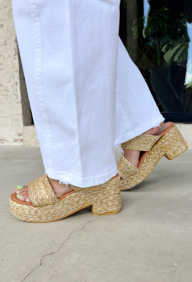 These white super high-rise barrel jeans are the fresh summer staple your closet needs! With their modern barrel leg silhouette, they bring a cool, effortless edge while still feeling easy to wear day-to-day. The super high-rise fit flatters, while the subtle distressing at the hem adds just the right amount of laid-back detail. Made with a soft, breathable blend, they’re perfect for warm days when you still want to look put together. You'll find yourself reaching for these all season long!