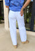 These white super high-rise barrel jeans are the fresh summer staple your closet needs! With their modern barrel leg silhouette, they bring a cool, effortless edge while still feeling easy to wear day-to-day. The super high-rise fit flatters, while the subtle distressing at the hem adds just the right amount of laid-back detail. Made with a soft, breathable blend, they’re perfect for warm days when you still want to look put together. You'll find yourself reaching for these all season long!