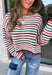 Cozy season gets a colorful update with this cream open knit sweater from Hyfve. The neutral cream base is woven with playful pops of red, blue, green, and black, giving it plenty of personality while still keeping it easy to mix and match. The open knit design creates a textured look that’s perfect for layering as those crisp fall days start turning colder. 