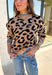 A cozy classic with a playful twist, this tan mock neck sweater is accented with a bold black leopard print. The pop of blue trim along the neckline, hem, and cuffs brings a modern contrast that sets it apart. Soft and stretchy in a comfy knit blend, it’s perfect for layering with denim, skirts, or trousers. A versatile piece that makes everyday outfits feel just a little more fun this fall.