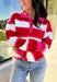 This striped sweater is giving retro prep meets pumpkin spice—and we’re here for it. With bold red, playful pink, and classic white stripes, it brings a cheerful twist to gloomy fall days. The collared neckline and front button details add a polished touch that feels just right for layering over your favorite jeans or corduroy skirt. Made from soft, cozy acrylic, it’s a lightweight piece that still keeps you warm on crisp autumn mornings. Whether you’re headed to the office or a cider-sipping weekend, this 