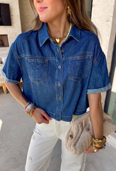 A true wardrobe staple with endless styling options! This dark wash denim button down top by Risen is the perfect mix of classic and cool. The rich wash gives it a polished feel, while the relaxed silhouette keeps it easy and laid-back. Designed with cuffed sleeves and front pocket details, this top has that effortless, throw-on-and-go vibe you’ll reach for again and again. Made from 100% cotton, it’s breathable, durable, and perfect for layering or wearing on its own.