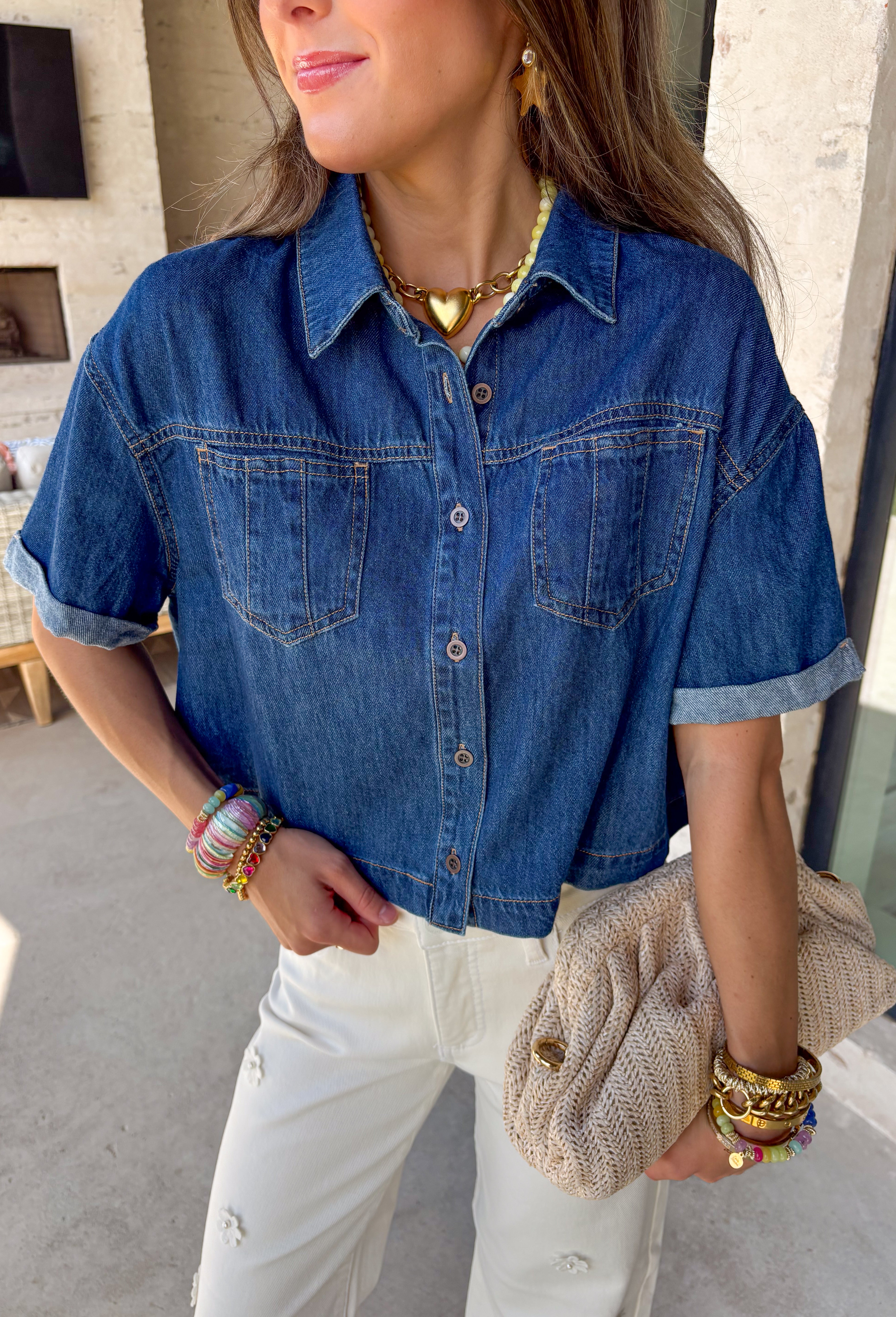 A true wardrobe staple with endless styling options! This dark wash denim button down top by Risen is the perfect mix of classic and cool. The rich wash gives it a polished feel, while the relaxed silhouette keeps it easy and laid-back. Designed with cuffed sleeves and front pocket details, this top has that effortless, throw-on-and-go vibe you’ll reach for again and again. Made from 100% cotton, it’s breathable, durable, and perfect for layering or wearing on its own.