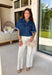 These cream wide leg jeans are what spring outfit dreams are made of! Designed with flattering tummy control and the prettiest monochromatic textured floral print, they bring just the right amount of feminine detail while still feeling easy and wearable. The pearl-centered blooms add such a special touch—like a little surprise moment that sets these apart from your everyday denim. With a comfortable stretch and breezy wide leg fit, they’re perfect for everything from brunch dates to weekend plans. 