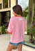 This pink floral top is full of those pretty little details that make summer outfits feel extra special! Featuring a colorful floral print with embroidered accents and white eyelet detailing, it has the perfect mix of texture and charm. The coral trim along the neckline and sleeves adds a fun pop of contrast that really makes it stand out. Lightweight and breathable in 100% cotton, it’s perfect for warm days when you want something easy but still eye-catching. 