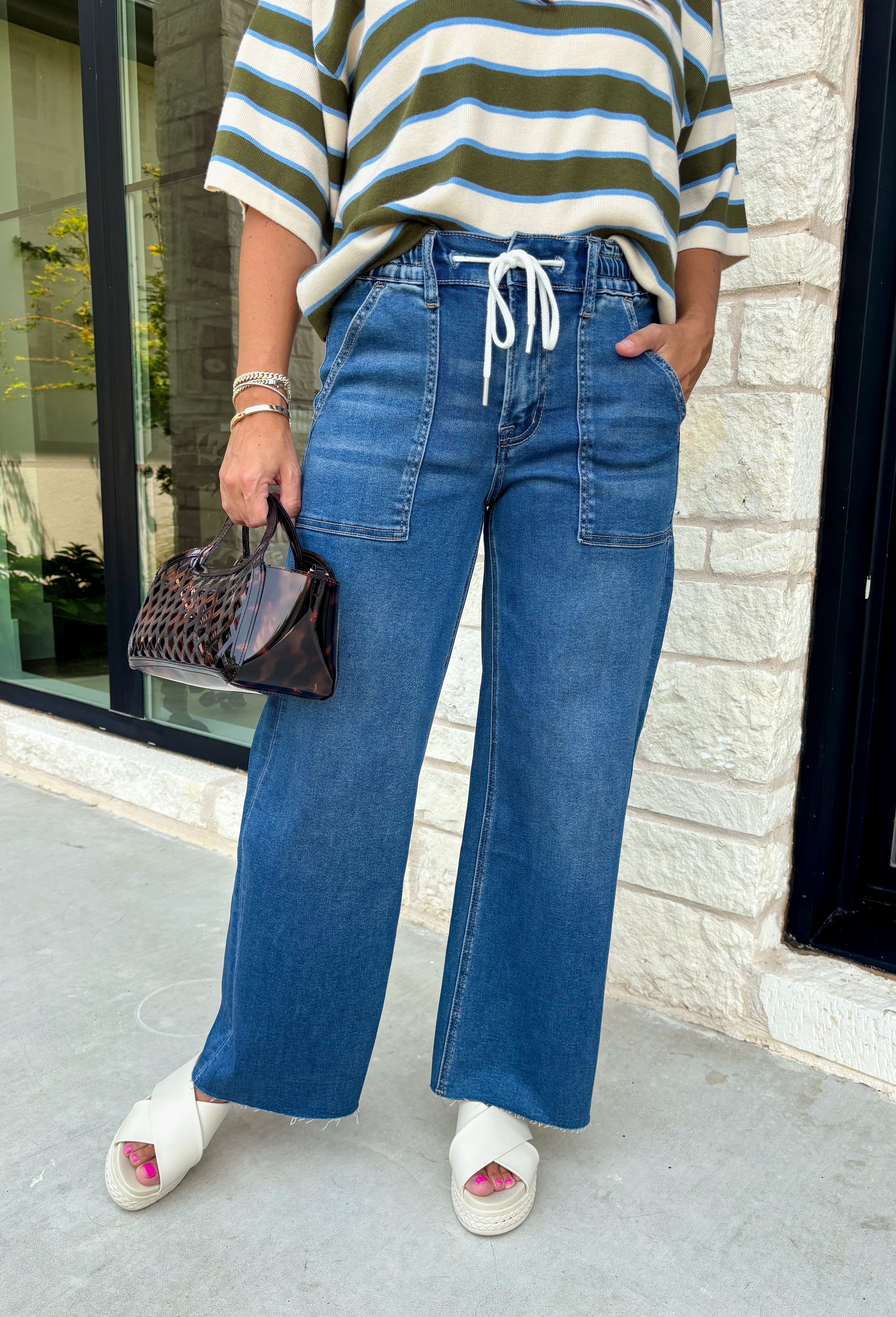 Everyone’s favorite jean just got even more comfortable! These medium wash wide leg jeans combine the relaxed feel of your favorite lounge pants with the polished look of classic denim. Designed with an elastic waistband and adjustable drawstring, they offer an easy, flattering fit you'll want to wear every day. The wide leg silhouette keeps them right on trend, while the soft modal blend gives them an incredibly comfortable feel.