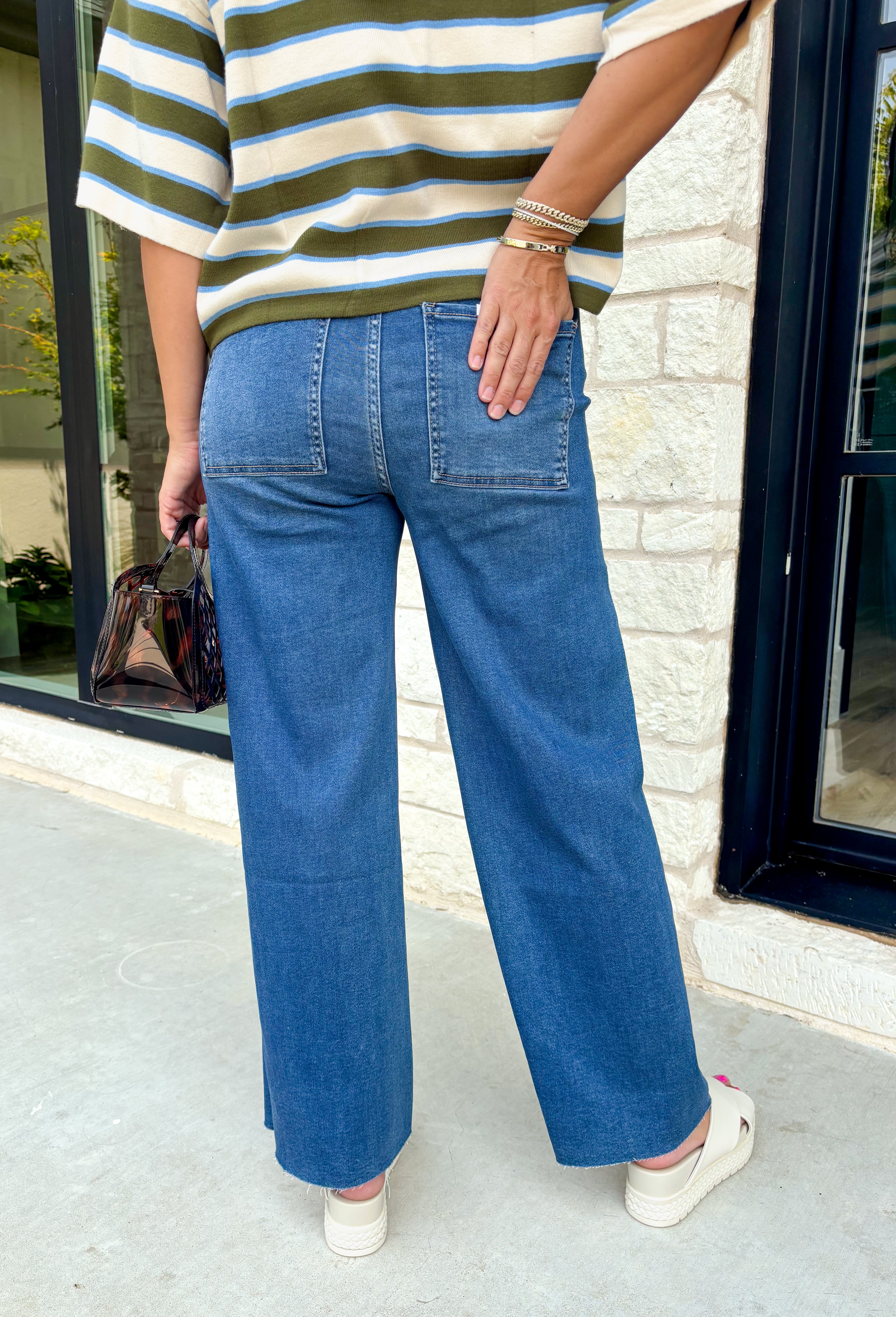 Everyone’s favorite jean just got even more comfortable! These medium wash wide leg jeans combine the relaxed feel of your favorite lounge pants with the polished look of classic denim. Designed with an elastic waistband and adjustable drawstring, they offer an easy, flattering fit you'll want to wear every day. The wide leg silhouette keeps them right on trend, while the soft modal blend gives them an incredibly comfortable feel.