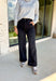 Relaxed and effortlessly cool, these black baggy wide leg jeans are the denim upgrade your fall closet needs. Designed with a flattering high waist and a trendy cuffed hem, they strike the perfect balance of casual and polished. These are great for showing off ankle boots or sneakers, while the soft, modal-blend denim keeps them comfortable with just the right amount of stretch. Whether styled with a cozy sweater or a sleek blouse, these jeans are versatile enough to take you anywhere this season.