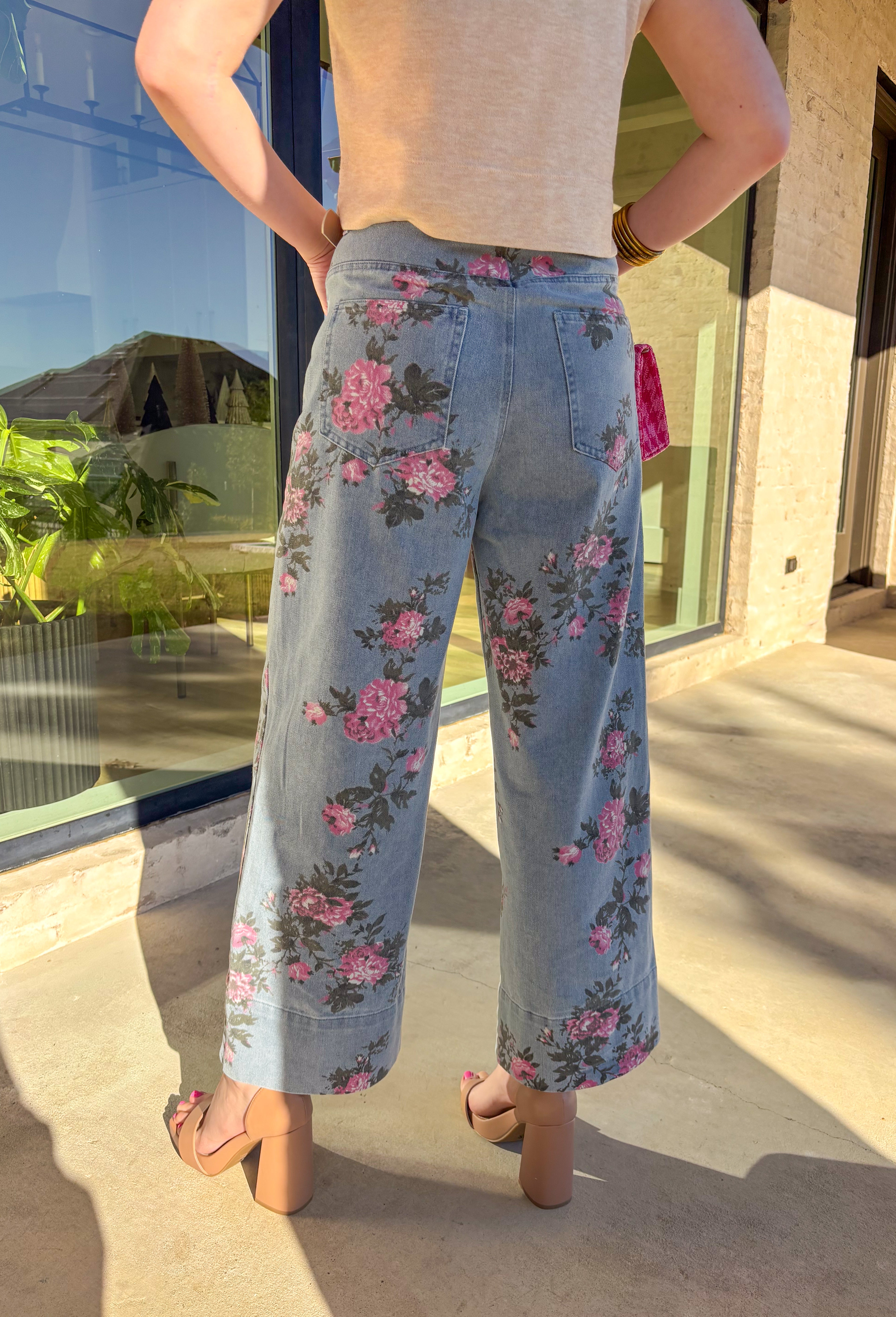 Fresh, playful, and made to stand out, this wide leg denim by Entro brings a fun spring twist to your everyday jeans. Featuring a pink floral print throughout, these jeans feel cheerful and unique while still being easy to style. The wide leg silhouette adds a relaxed, on-trend fit that pairs perfectly with simple tees, lightweight knits, and spring blouses.