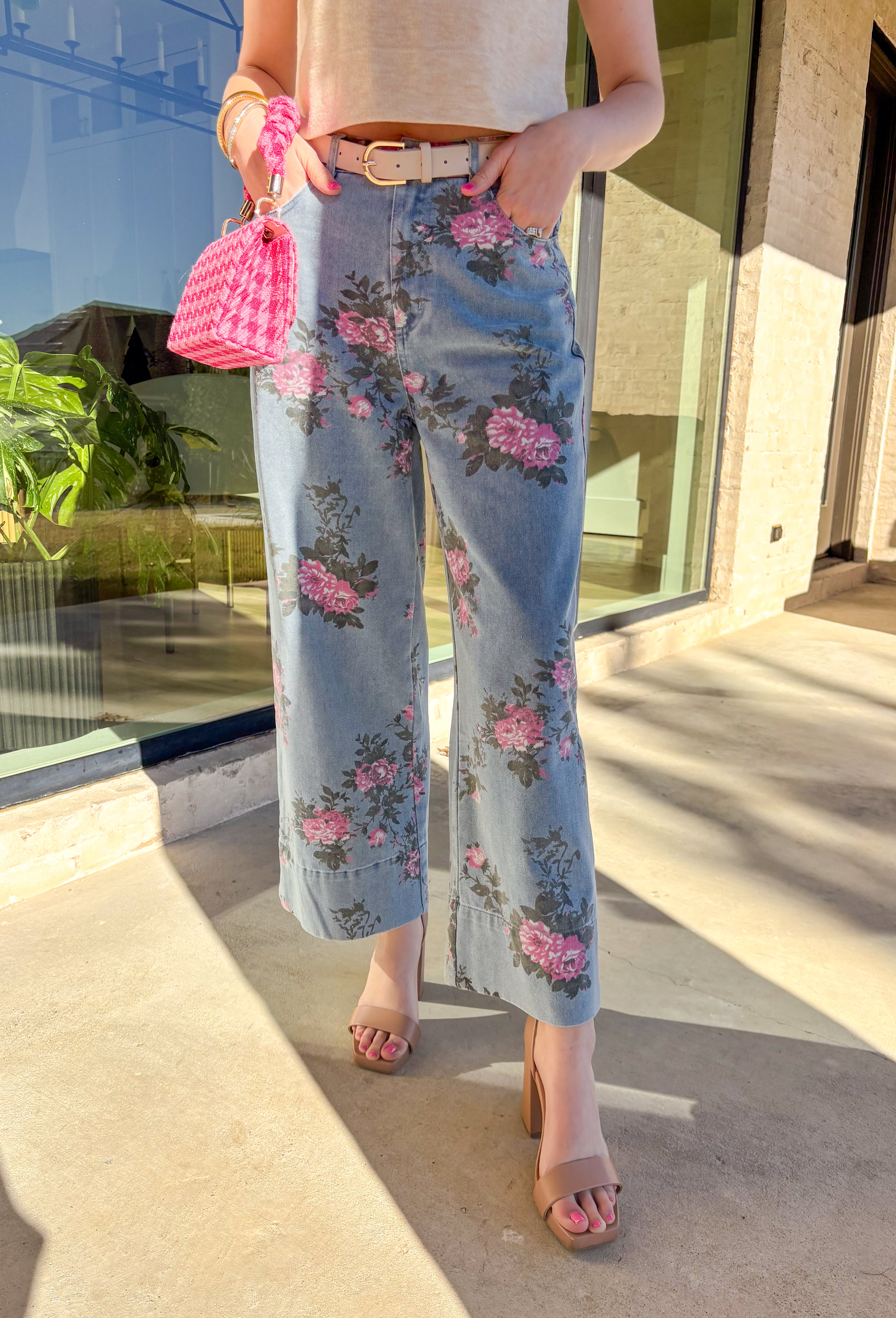 Fresh, playful, and made to stand out, this wide leg denim by Entro brings a fun spring twist to your everyday jeans. Featuring a pink floral print throughout, these jeans feel cheerful and unique while still being easy to style. The wide leg silhouette adds a relaxed, on-trend fit that pairs perfectly with simple tees, lightweight knits, and spring blouses.