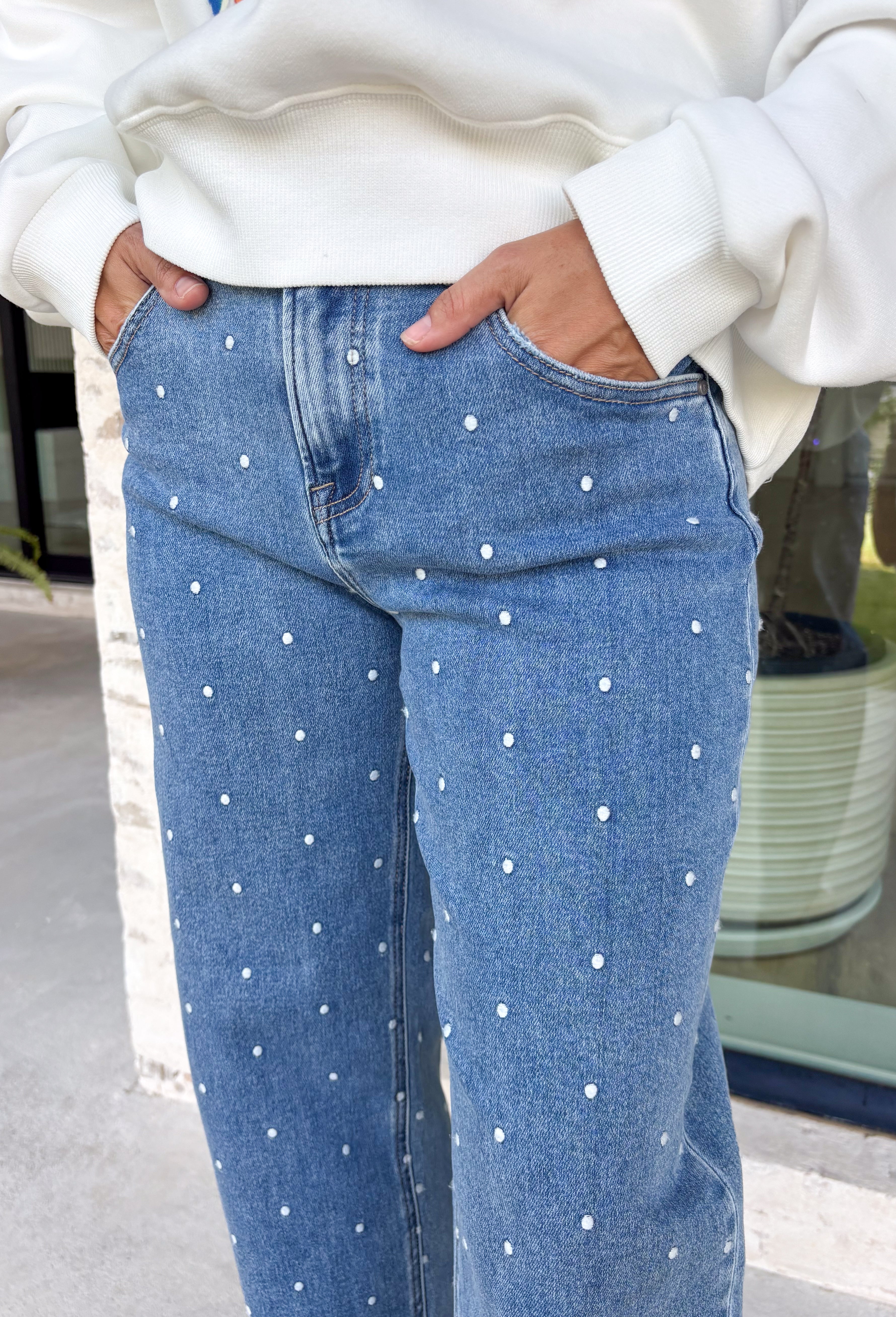 Add a playful twist to your everyday denim with these standout barrel jeans from Risen. Designed in a classic medium wash, these high-rise cropped jeans feature embroidered polka dots throughout for a fun, feminine detail that's easy to wear. The on-trend barrel leg silhouette creates a relaxed yet flattering fit, while the comfortable stretch fabric keeps you feeling great from morning to night. 