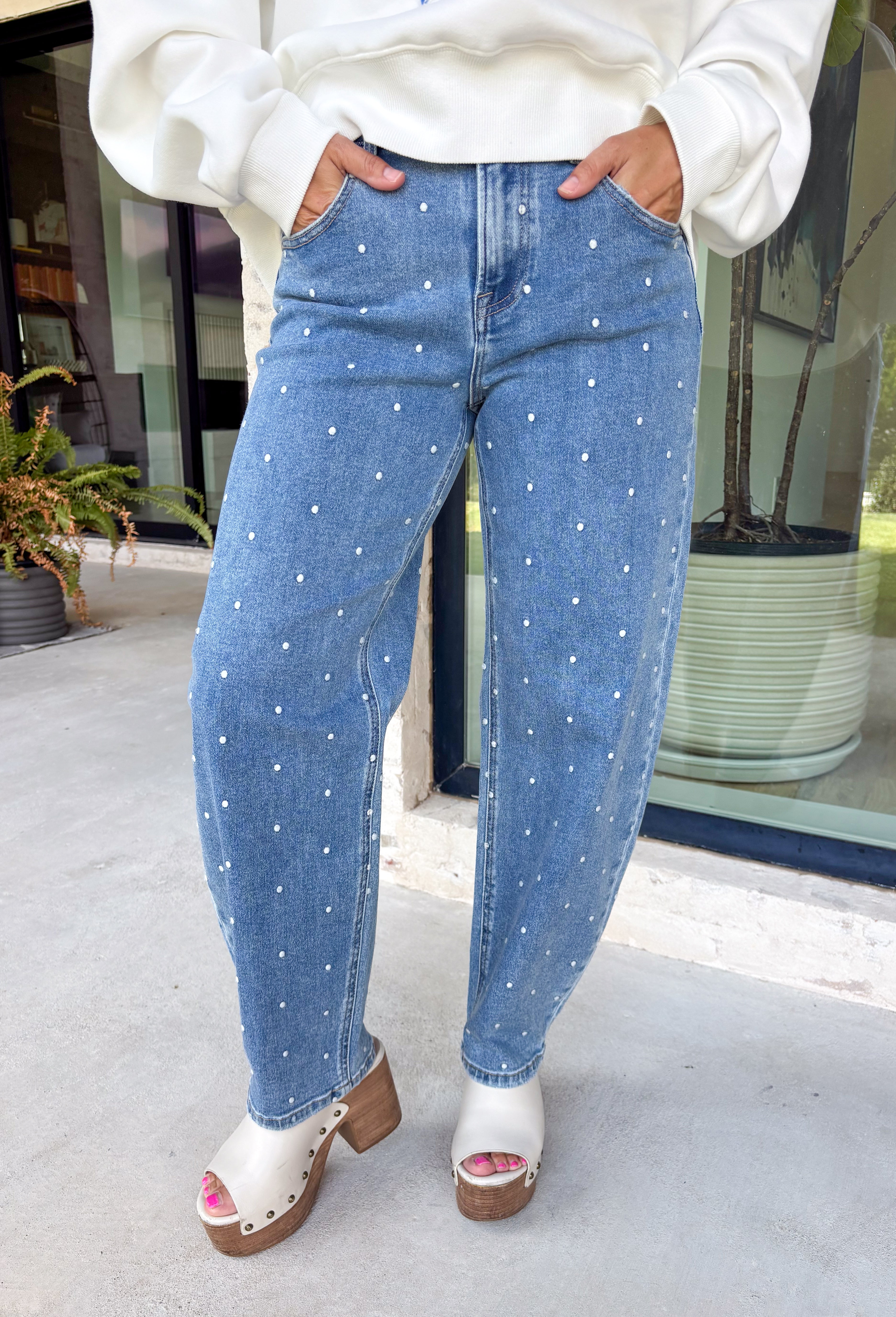Add a playful twist to your everyday denim with these standout barrel jeans from Risen. Designed in a classic medium wash, these high-rise cropped jeans feature embroidered polka dots throughout for a fun, feminine detail that's easy to wear. The on-trend barrel leg silhouette creates a relaxed yet flattering fit, while the comfortable stretch fabric keeps you feeling great from morning to night. 