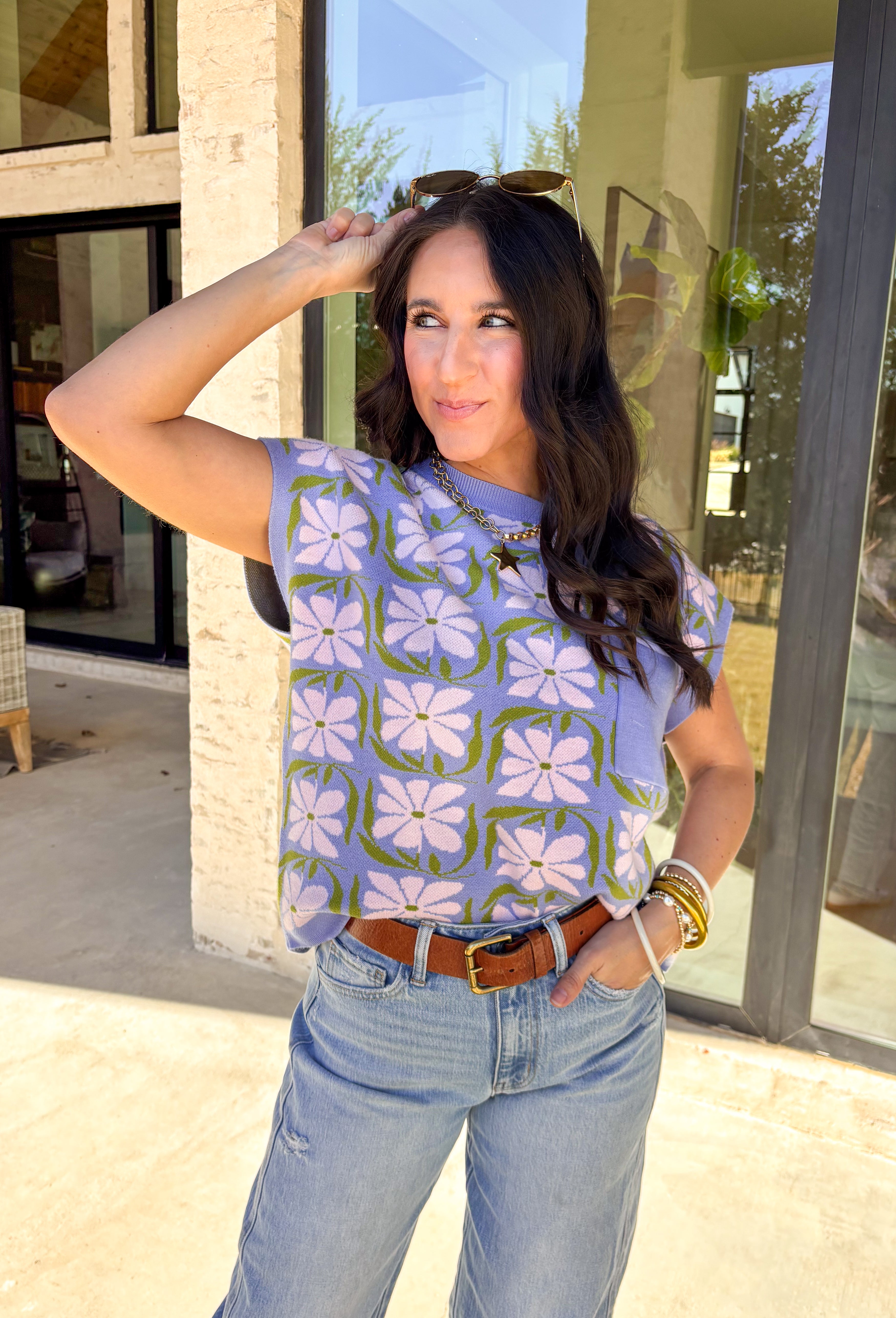 Soft, sweet, and made for spring, this lavender short sleeve sweater by Entro is the perfect mix of cozy and cute. Featuring a floral print throughout, it brings a fresh pop of pattern while still feeling easy to wear. The front pocket adds a casual touch, making this sweater perfect for everyday outfits—whether you’re pairing it with denim, a skirt, or dressing it up with trousers. Lightweight and breathable, it’s an easy spring knit you’ll reach for again and again.