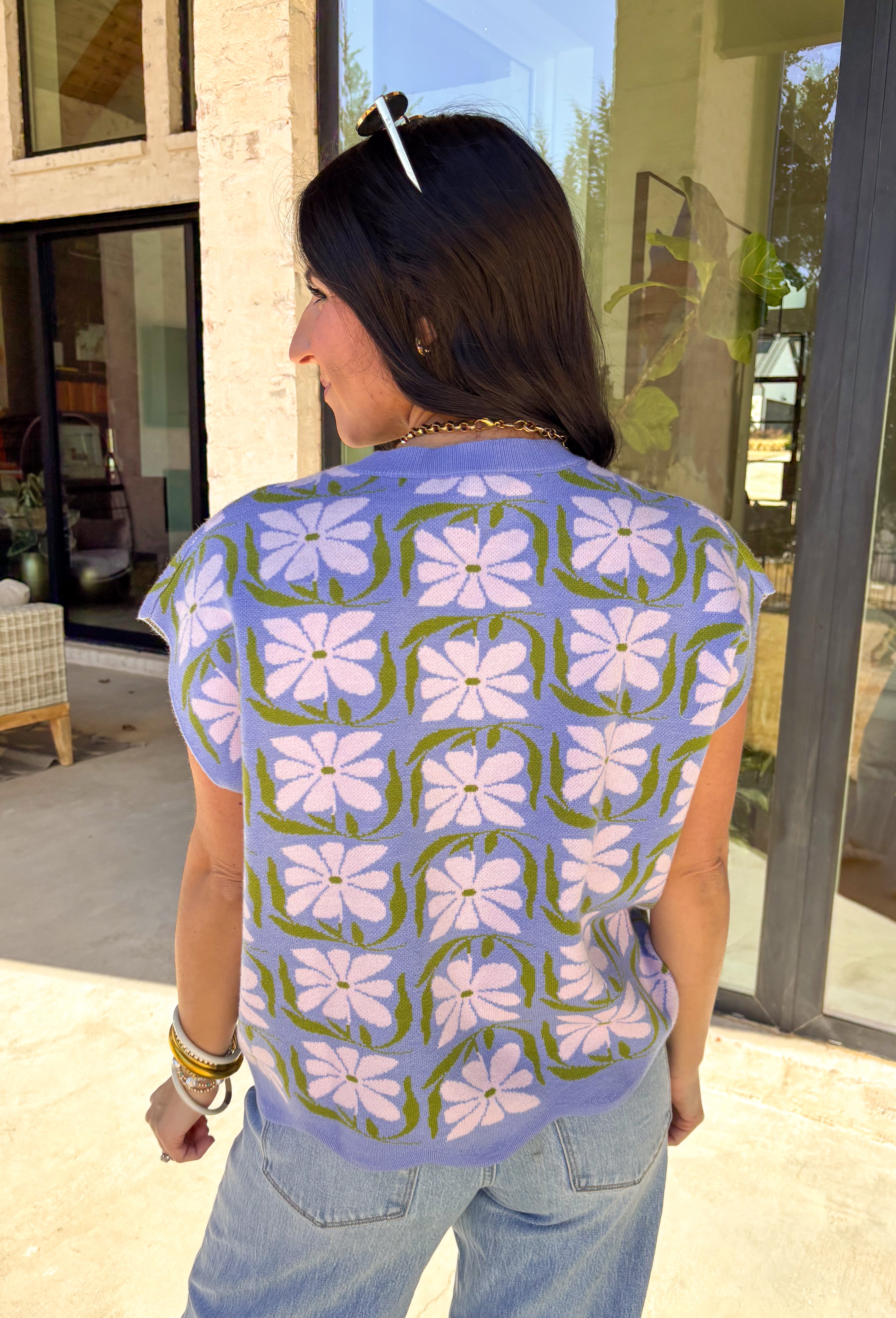 Soft, sweet, and made for spring, this lavender short sleeve sweater by Entro is the perfect mix of cozy and cute. Featuring a floral print throughout, it brings a fresh pop of pattern while still feeling easy to wear. The front pocket adds a casual touch, making this sweater perfect for everyday outfits—whether you’re pairing it with denim, a skirt, or dressing it up with trousers. Lightweight and breathable, it’s an easy spring knit you’ll reach for again and again.