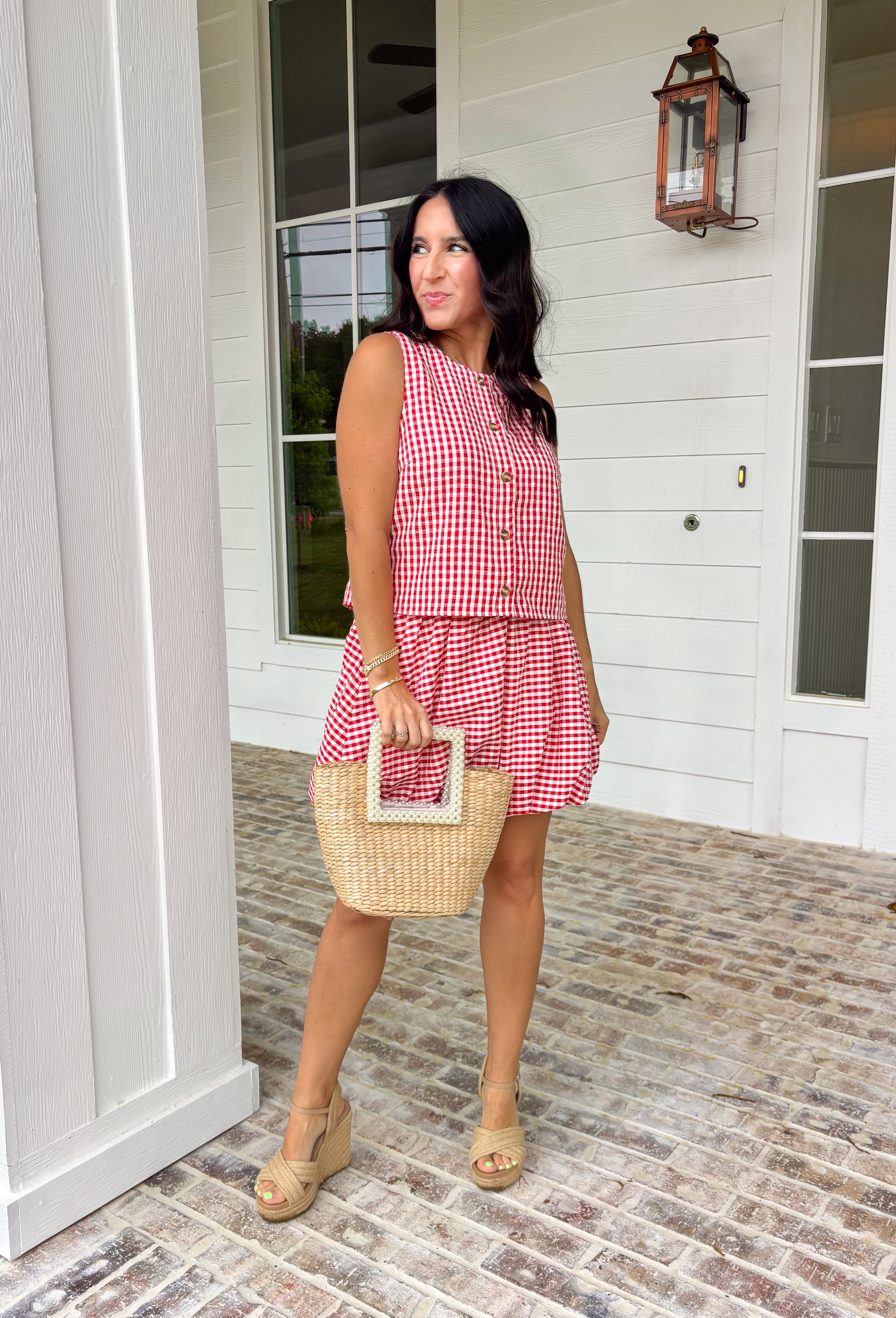 Nothing says summer quite like red and white gingham! This bubble skirt is giving backyard barbecues, fireworks at dusk, and all the sweet summertime moments. The playful bubble hem adds volume and movement, while the elastic waistband keeps it comfortable and easy to wear all day long. Style it with the matching top for the cutest coordinated set, or mix it with a simple white tank or graphic tee for an effortless look. It’s the perfect pick for the 4th of July and beyond.