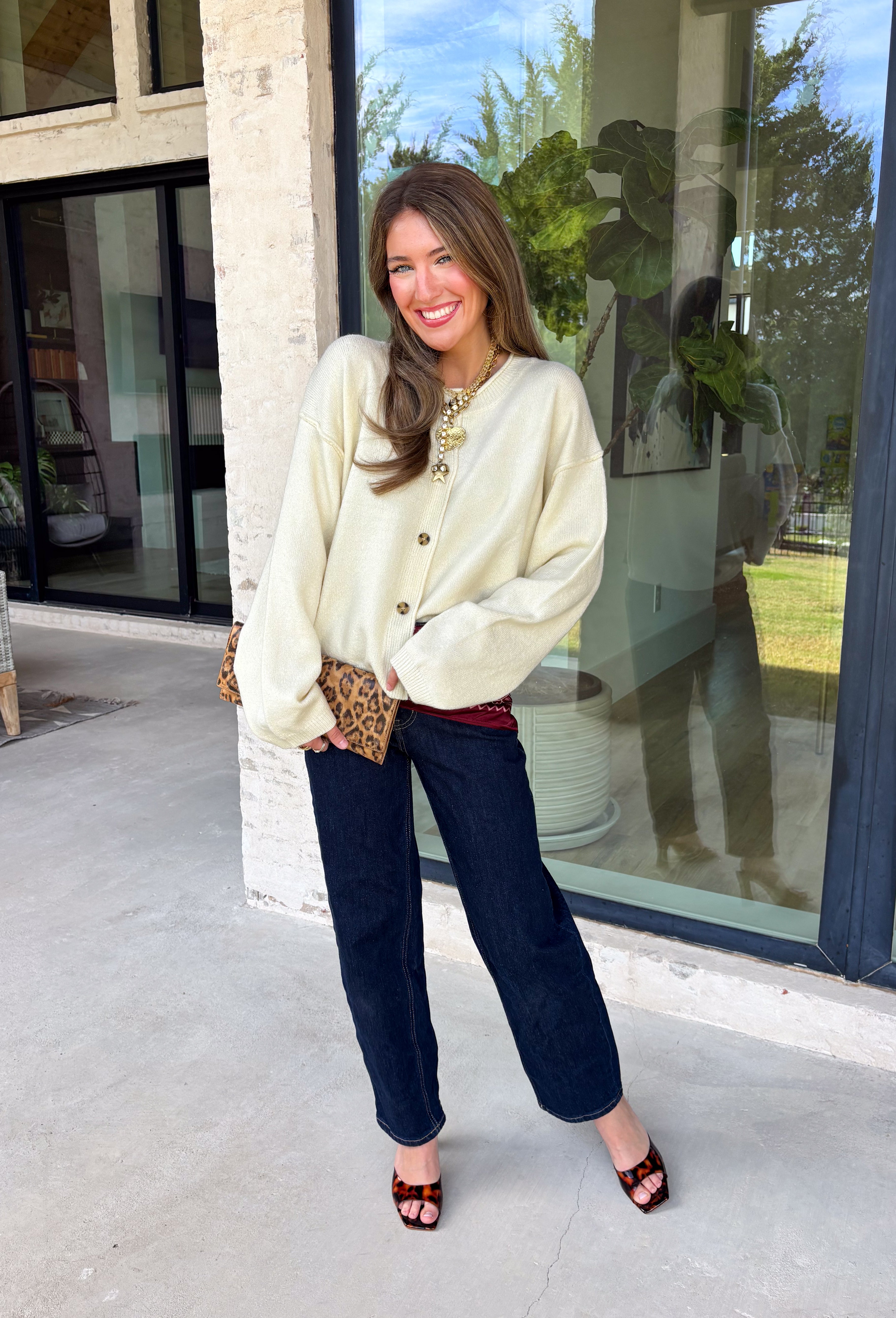 A classic cardigan is a wardrobe staple you'll wear year after year, and this timeless style from Double Zero is the perfect addition to your collection. Designed in a soft cream knit, this cozy cardigan features beautiful tortoise buttons that add a warm, elevated touch to its classic silhouette. Ribbed detailing at the neckline, hem, and cuffs creates a polished finish, while the soft knit keeps you comfortable all day long. 